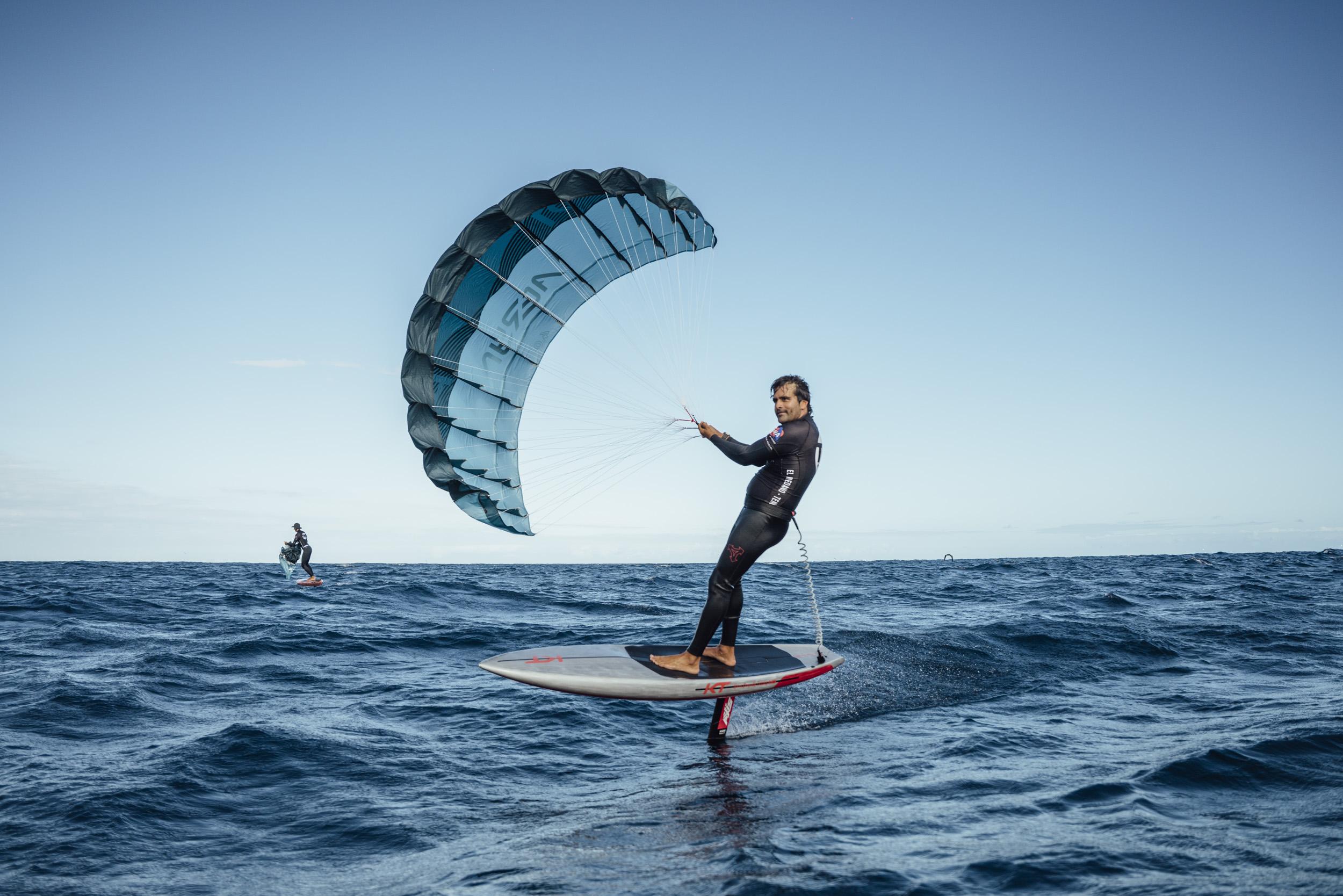 Aeryn P1 Pocket Wing rider foiling along a volcanic coastline