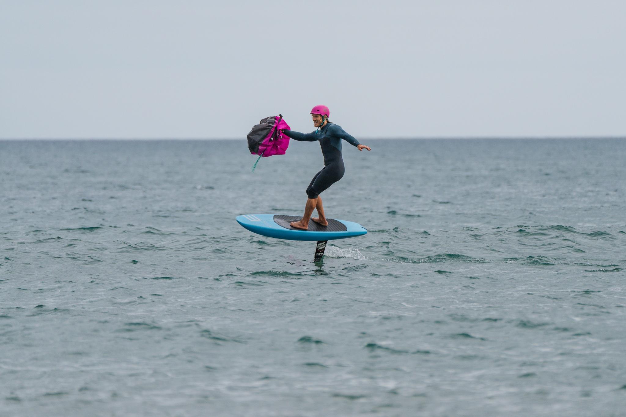 Ensis Roger rider carving through turquoise waves