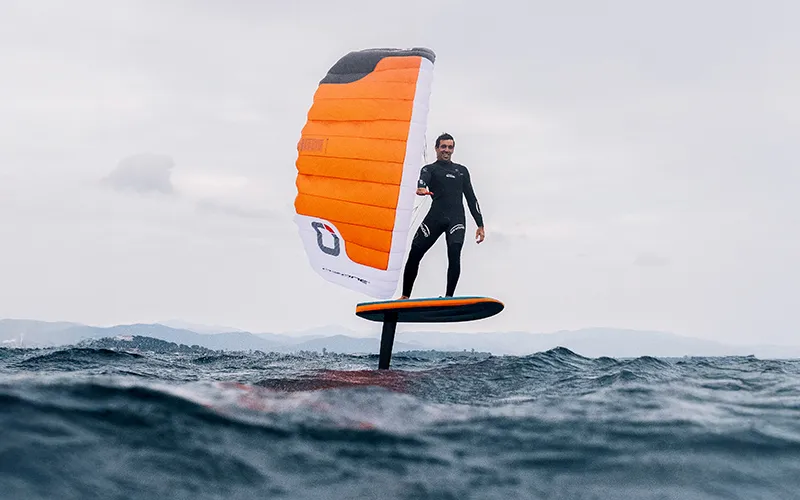 Ozone Pocket Rocket rider foiling at low water level with wing fully inflated